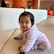 Evelyn Hanna joined the competition — help win amazing prizes! baby, bench, child, couch, curious, face, fleece, honeycomb_pattern, indoor, keys, lavender_clothing, orange_decor, ponytail, portrait, remote_control, restaurant, sitting, smiling, squatting, toddler
