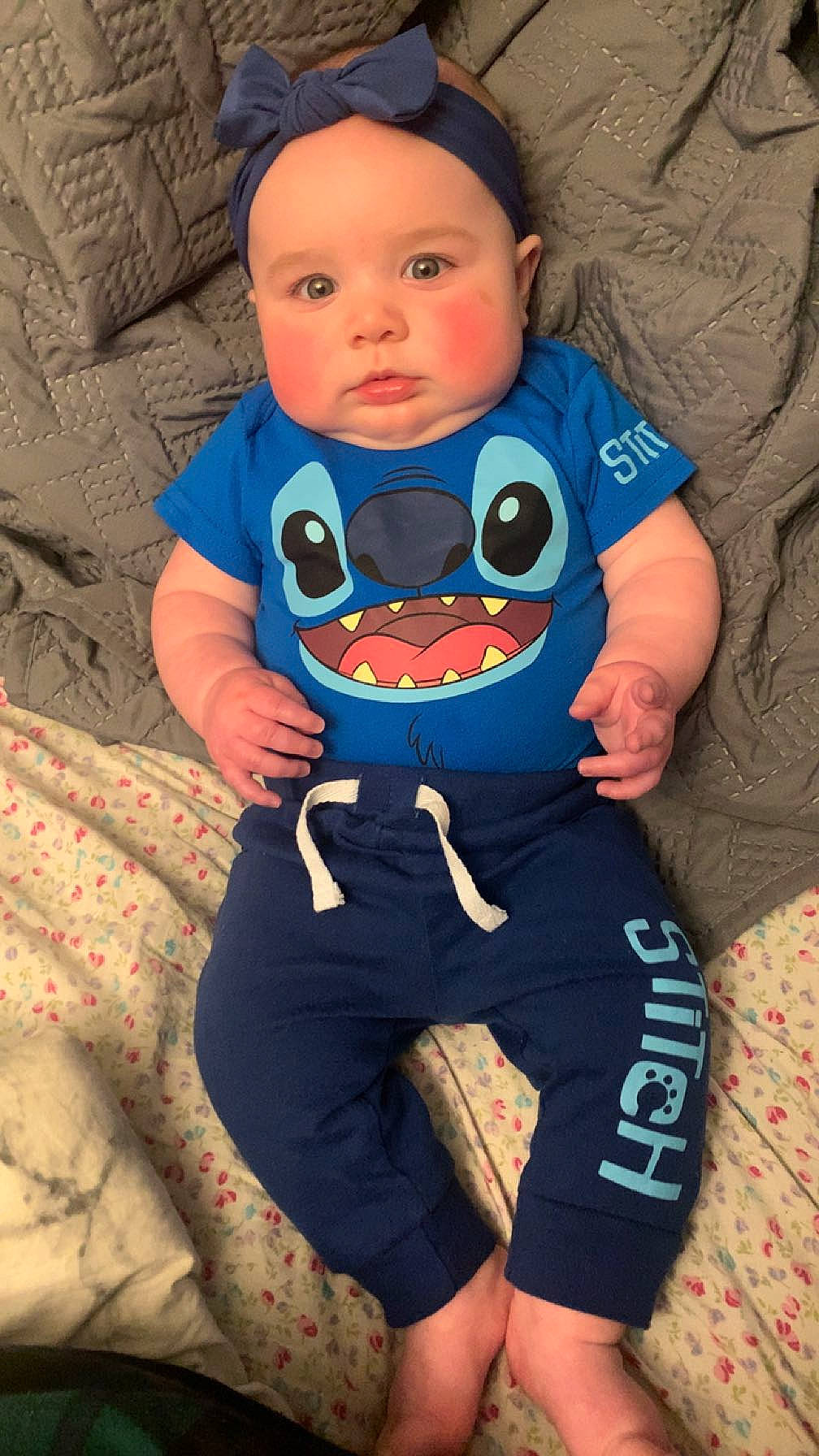 Luna joined the competition — help win amazing prizes! arm, baby, baby_toddler_clothing, comfort, electric_blue, eye, face, fictional_character, fun, happy, head, headwear, human_body, linens, mouth, pattern, person, personal_protective_equipment, sitting, sleeve