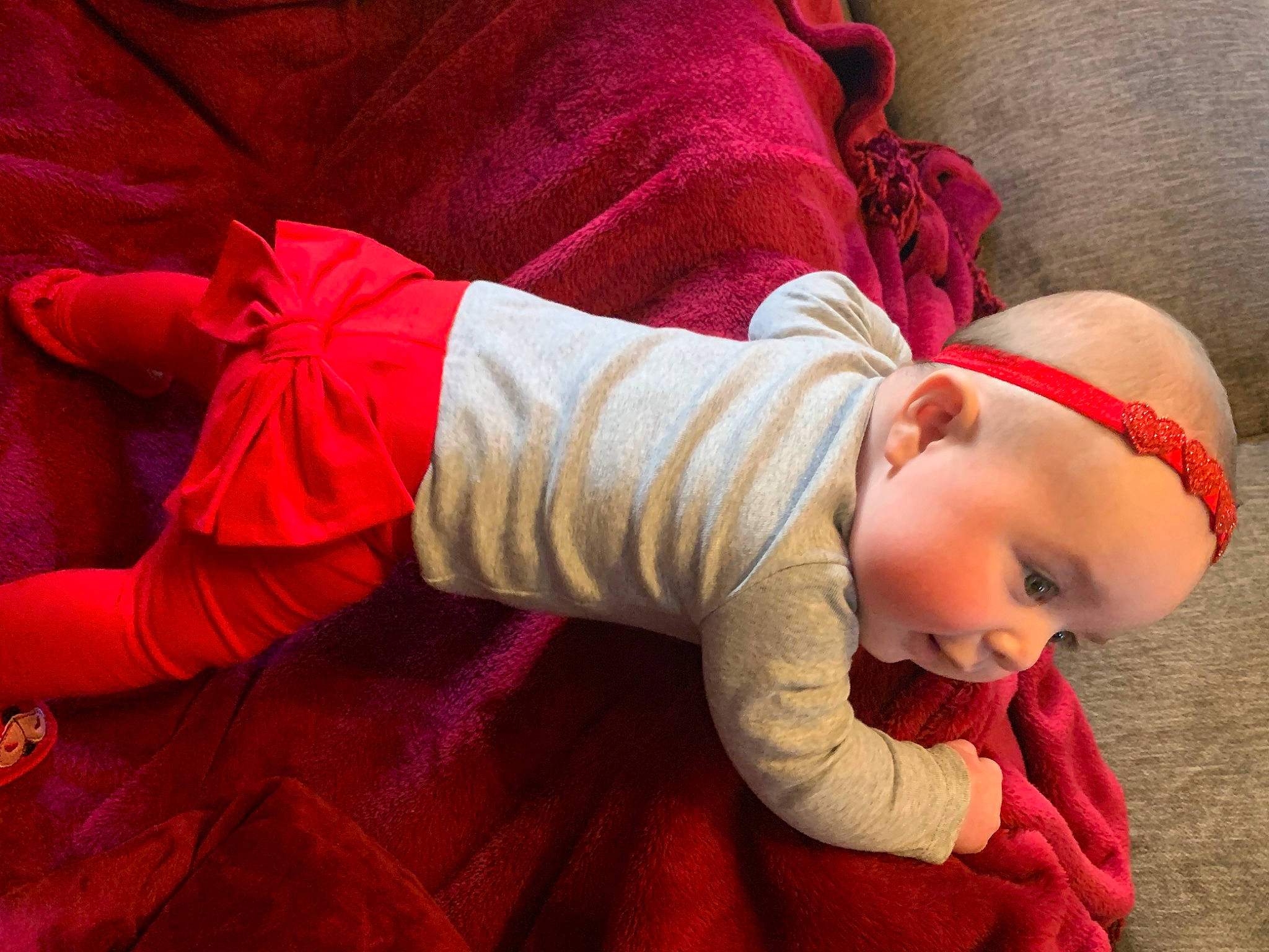 Luna is registered to the contest to win money with this photo: baby, baby_toddler_clothing, child, comfort, finger, flooring, glasses, hand, happy, hat, human_body, leg, person, pink, product, skin, sleeve, smile, toddler, tree