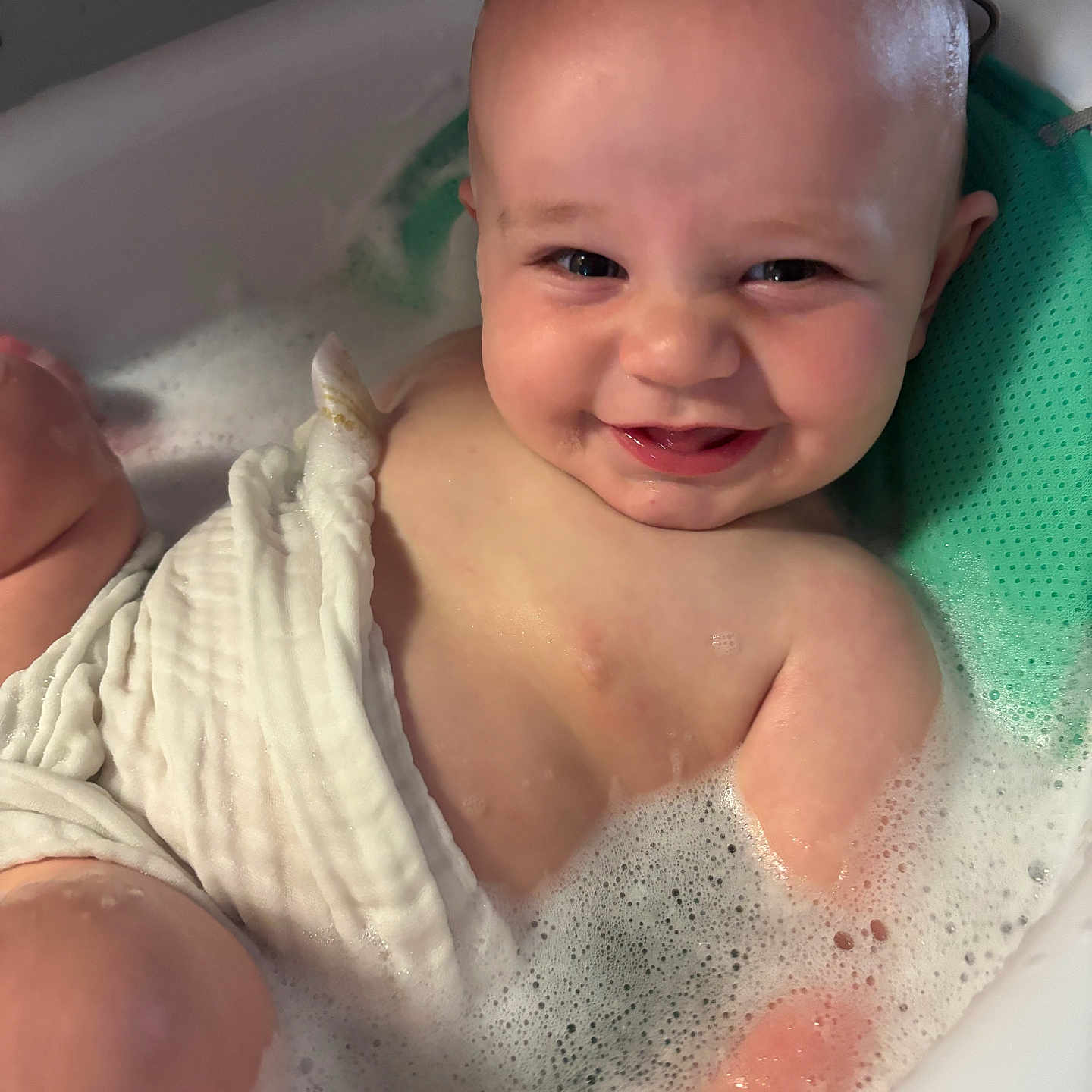 Jace joined the competition — help win amazing prizes! baby, bath, bubbles, smile, water, skin, face, child, infant, happy, foam, white_cloth, bathtub, cute, person, relaxation, sitting, playful, indoors, head