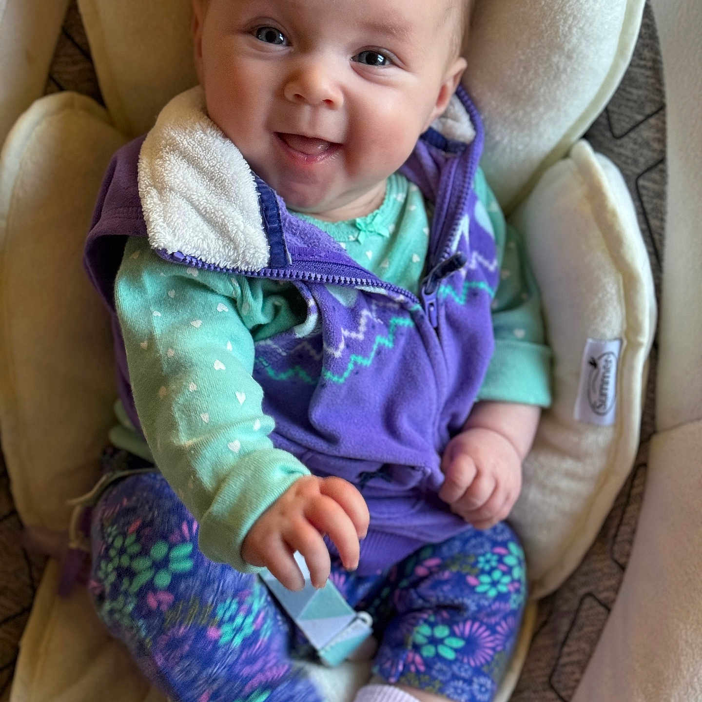 Savannah is registered to the contest to win money with this photo: baby, chair, clothing, coat, couch, cushion, face, furniture, happy, hat, head, homedecor, jacket, knitwear, pants, person, photography, portrait, sitting, sweater