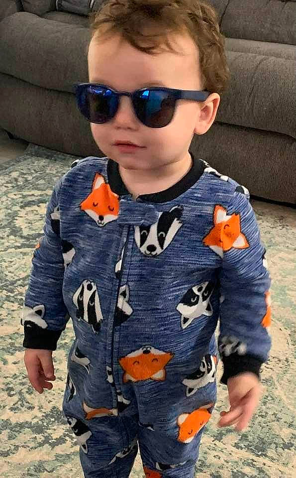 Gideon is registered to the contest to win money with this photo: baby_toddler_clothing, child, cool, eyewear, face, glasses, goggles, hair, head, military_camouflage, orange, outerwear, people, person, personal_protective_equipment, sleeve, summer, sunglasses, t_shirt, toddler