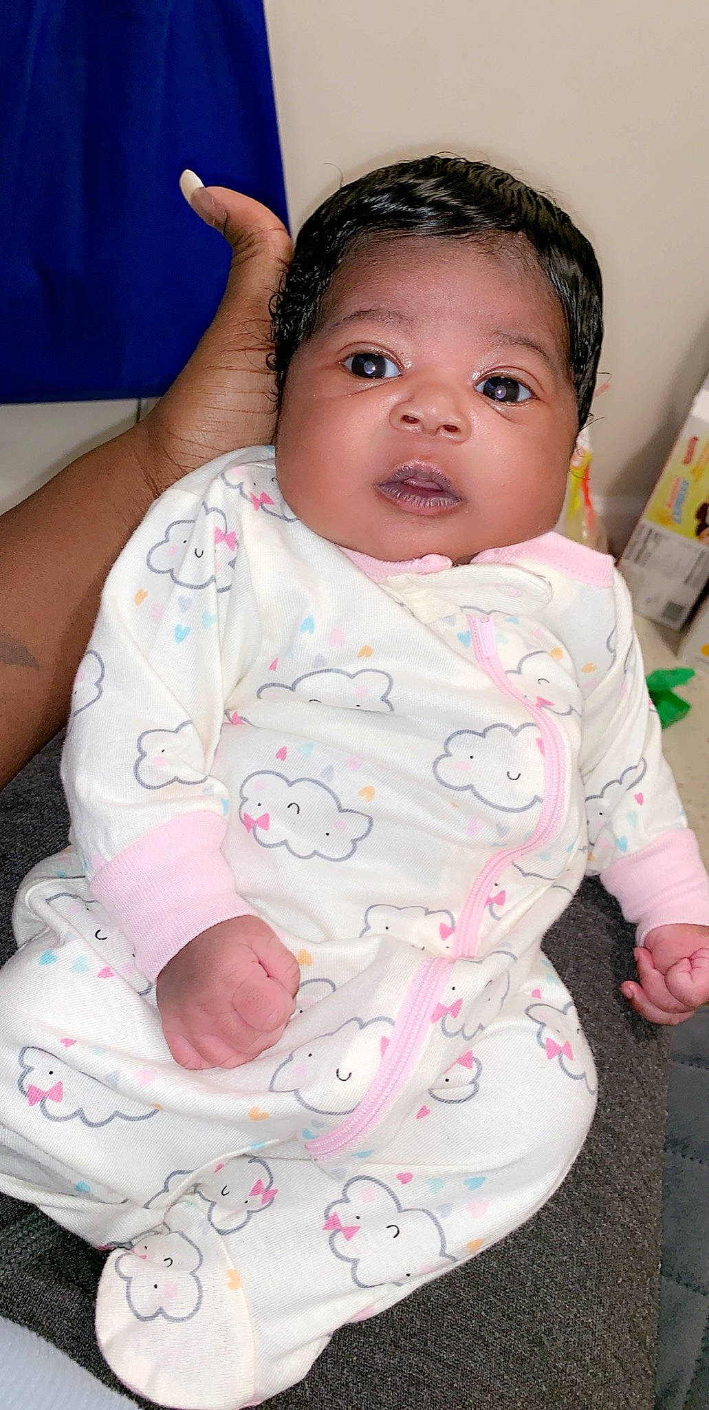 Khaila is registered to the contest to win money with this photo: baby, baby_toddler_clothing, cheek, child, eye, head, lip, nose, person, pink, product, sitting, skin, smile, toddler