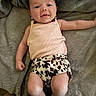 Madilynn joined the competition — help win amazing prizes! baby, infant, smiling, face, clothing, tank_top, shorts, leopard_print, blanket, soft_texture, lying_down, happy, cute, skin, person, young_child, indoors, portrait, one_child, casual_wear