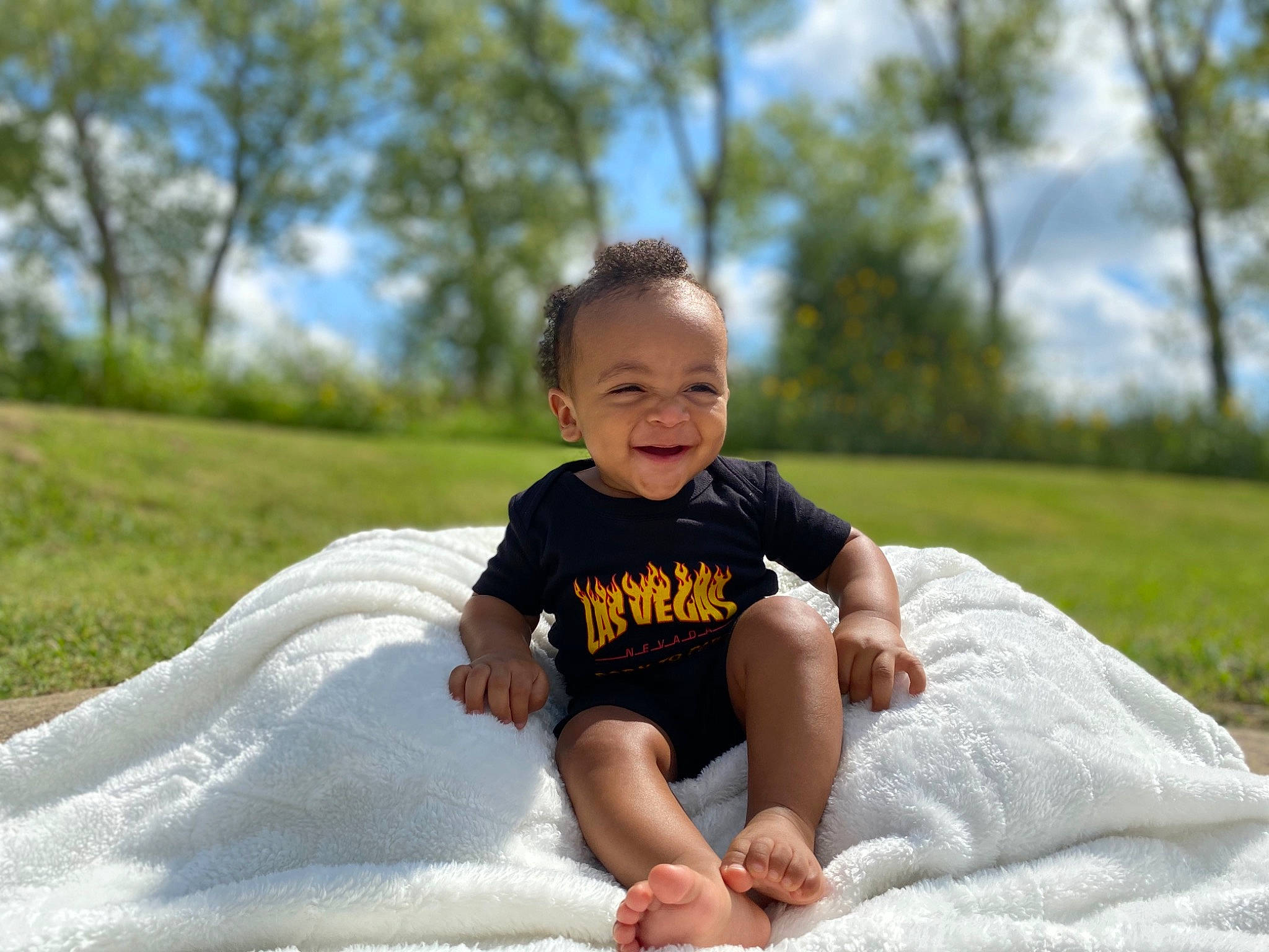 Samar is registered to the contest to win money with this photo: baby, baby_toddler_clothing, barefoot, child, comfort, ear, foot, happy, joy, people_in_nature, person, portrait_photography, sitting, toddler