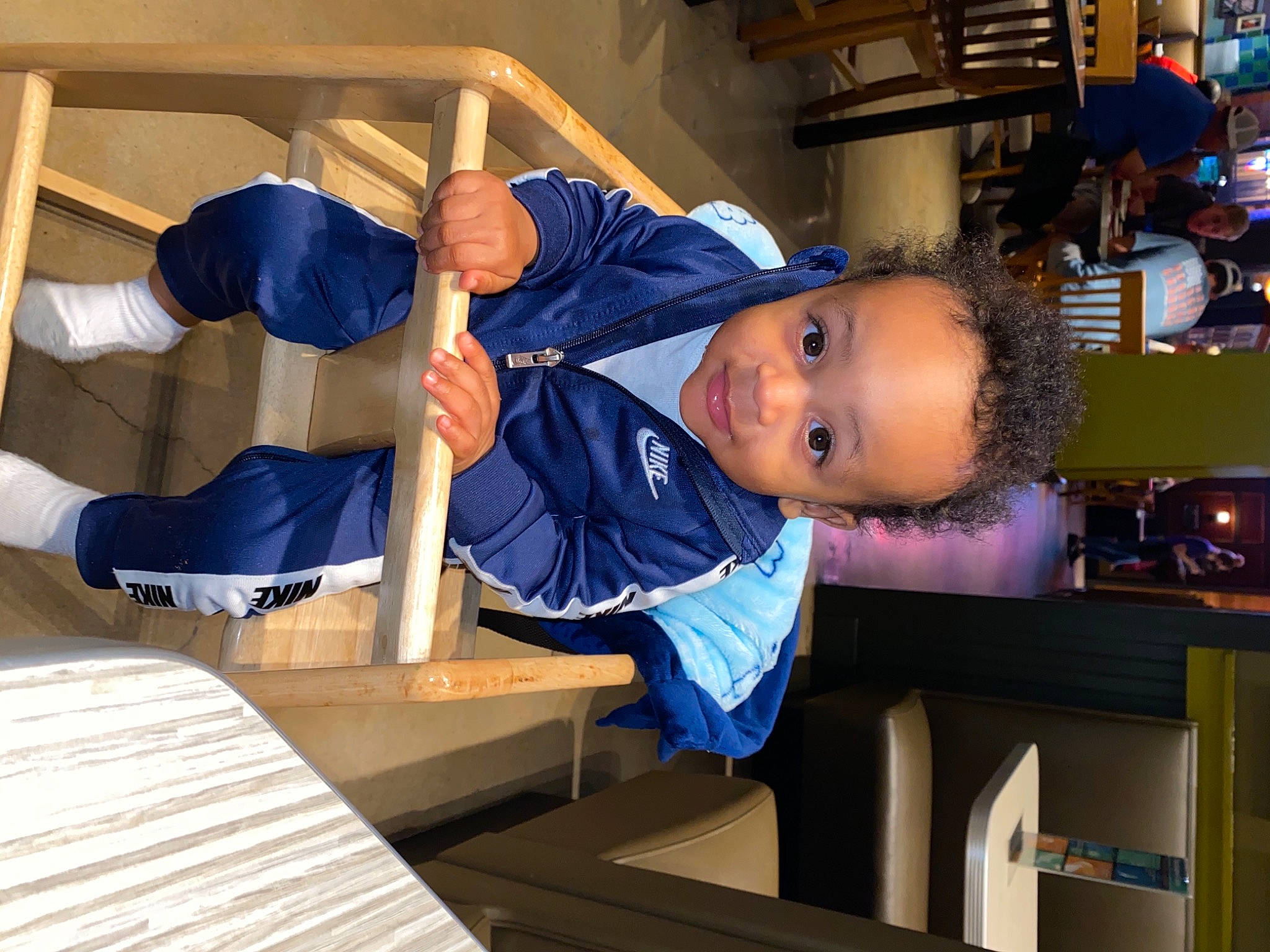 Samar is registered to the contest to win money with this photo: baby_toddler_clothing, balance, elbow, joy, person, shelf, shelving, toddler, under_exposed