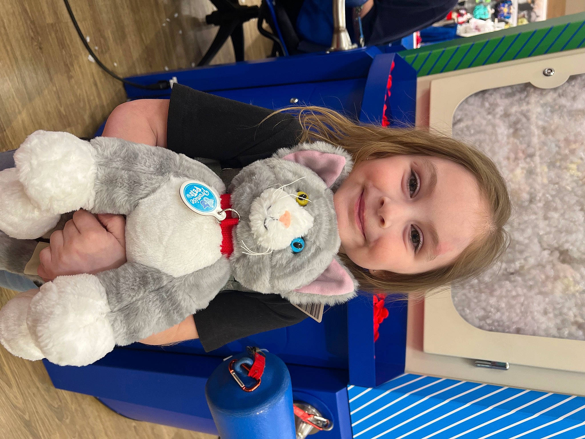 Andi is registered to the contest to win money with this photo: baby, baby_products, baby_toddler_clothing, baby_toys, blue, chair, cheek, child, eye, fun, happy, joy, person, plush, room, smile, stuffed_toy, teddy_bear, toddler, toy
