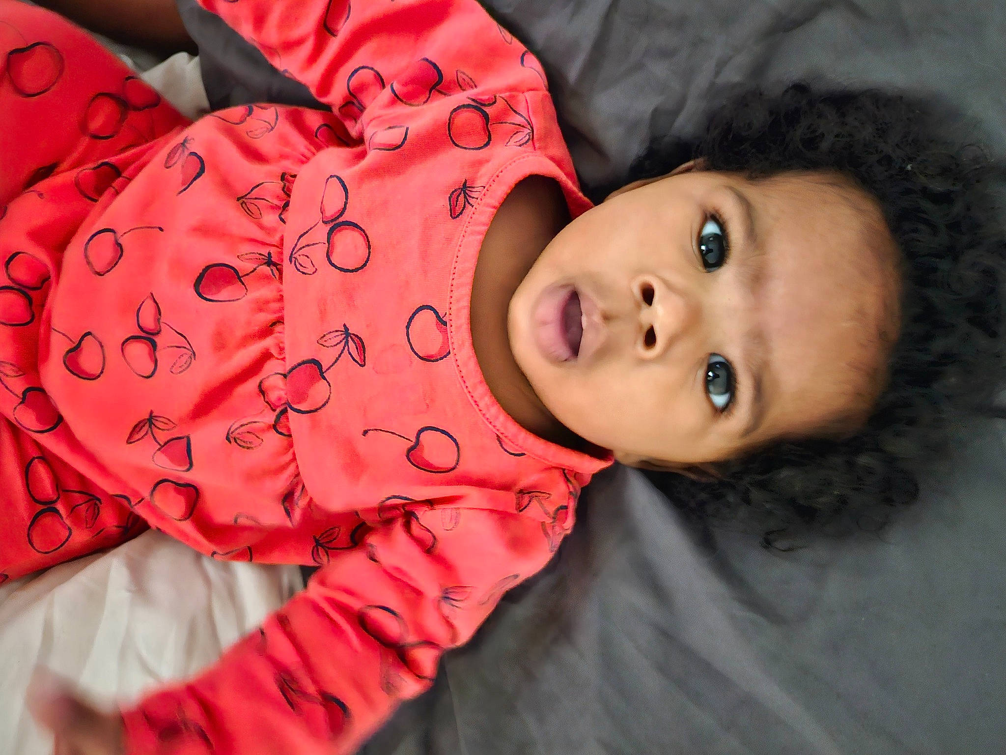 Janelle is registered to the contest to win money with this photo: baby, baby_products, baby_toddler_clothing, cheek, child, eyelash, fur, happy, headgear, human_body, lip, magenta, mouth, neck, nose, pattern, person, portrait_photography, skin, sleeve