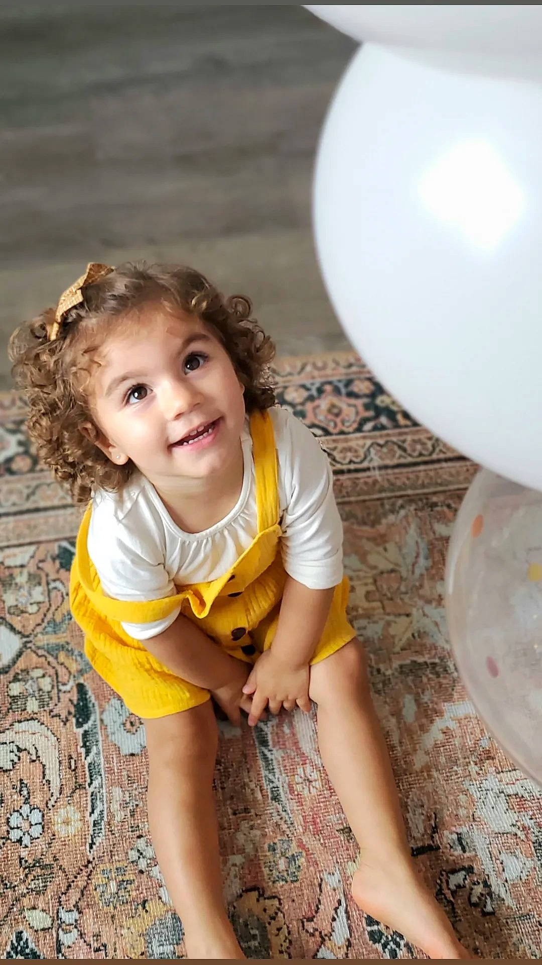 Mireya joined the competition — help win amazing prizes! balloon, child, flash_photography, flooring, fun, grass, happy, head, human_leg, joy, leisure, party_supply, pattern, person, plate, sandal, sitting, smile, soil, t_shirt