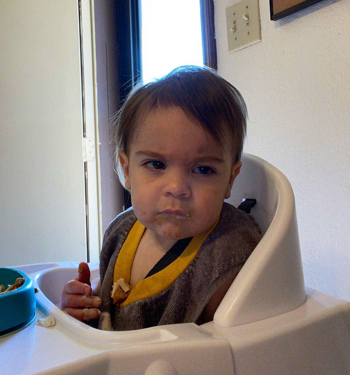 Lucas is registered to the contest to win money with this photo: baby, car_seat, chair, cheek, child, comfort, drinkware, eyebrow, fun, happy, nose, person, picture_frame, plate, skin, table, tableware, toddler, vehicle_door, window