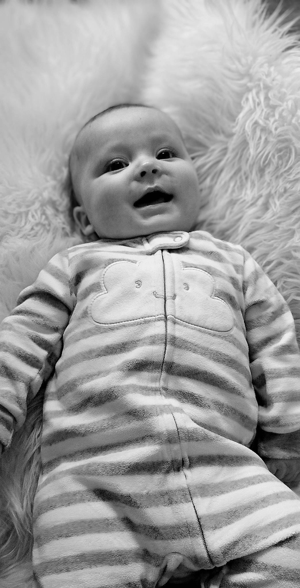 Franklin is registered to the contest to win money with this photo: baby, cheek, chin, eye, eyebrow, face, facial_expression, flash_photography, hairstyle, happy, head, human, iris, lip, mouth, nose, person, skin, sleeve, smile