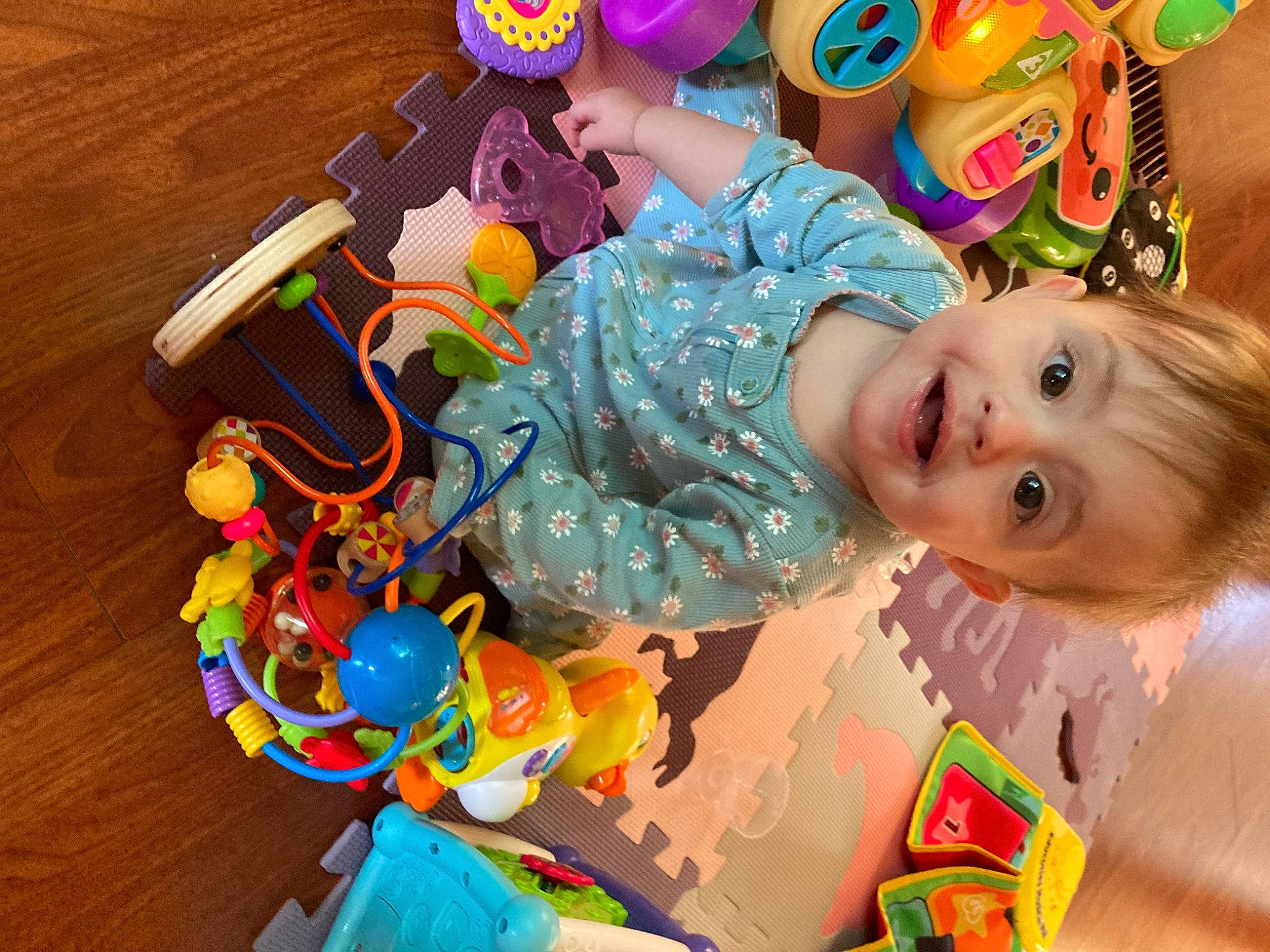 Journi is registered to the contest to win money with this photo: baby, baby_playing_with_toys, baby_products, baby_toddler_clothing, baby_toys, child, event, facial_expression, fun, happy, leisure, party, person, play, room, sitting, smile, toddler, toy, wood