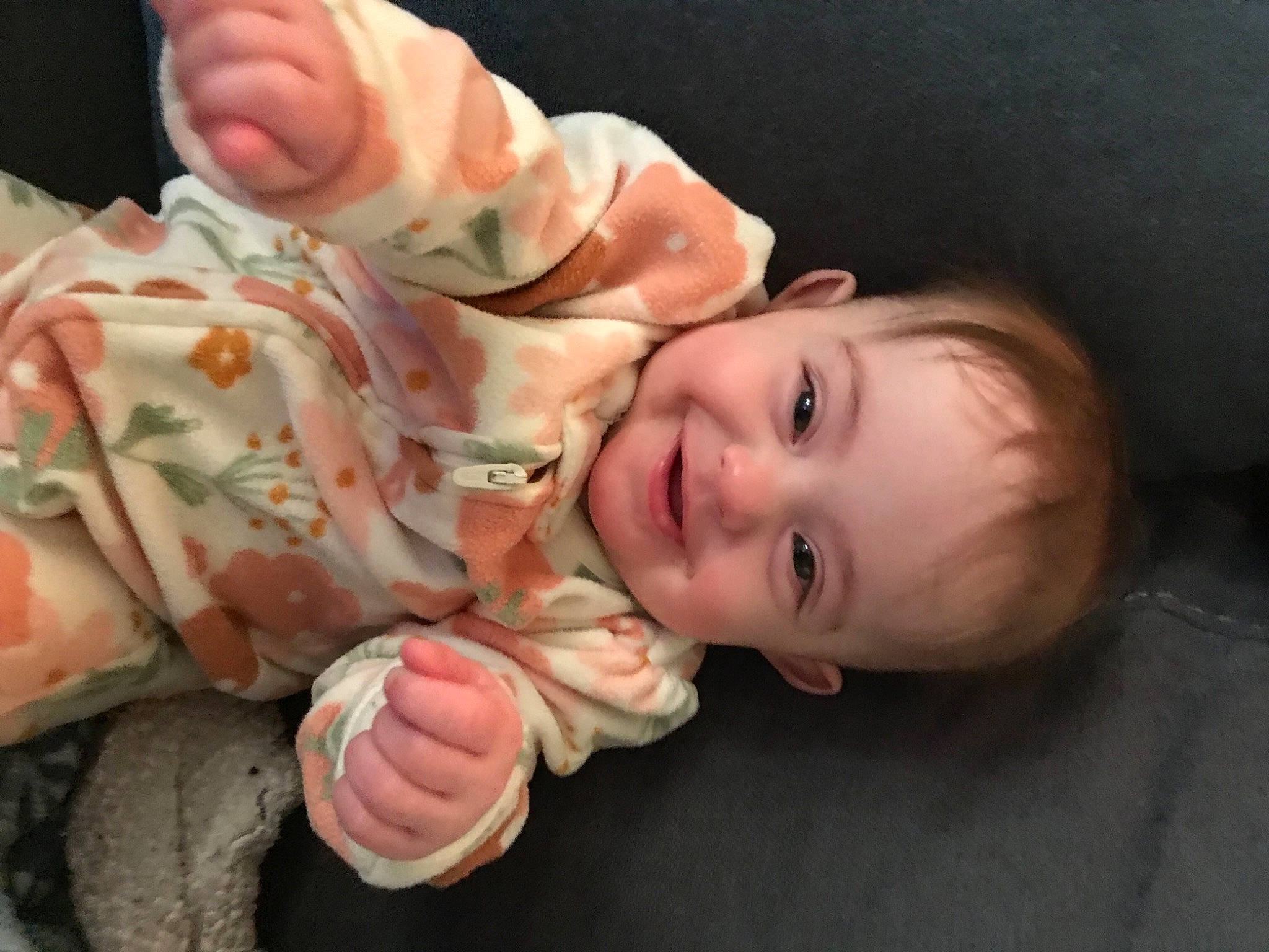 Journi is registered to the contest to win money with this photo: baby, baby_toddler_clothing, cheek, child, eye, face, finger, flash_photography, gesture, hand, happy, human_body, joy, lip, mouth, nail, nose, person, skin, smile