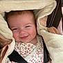 Athéna participe au concours pour gagner de l'argent avec cette photo : baby, smiling, tongue_out, car_seat, jacket, fluffy, child, infant, seatbelt, cute, happy, face, clothing, closeup, person, indoors, skin, head, hand, warm