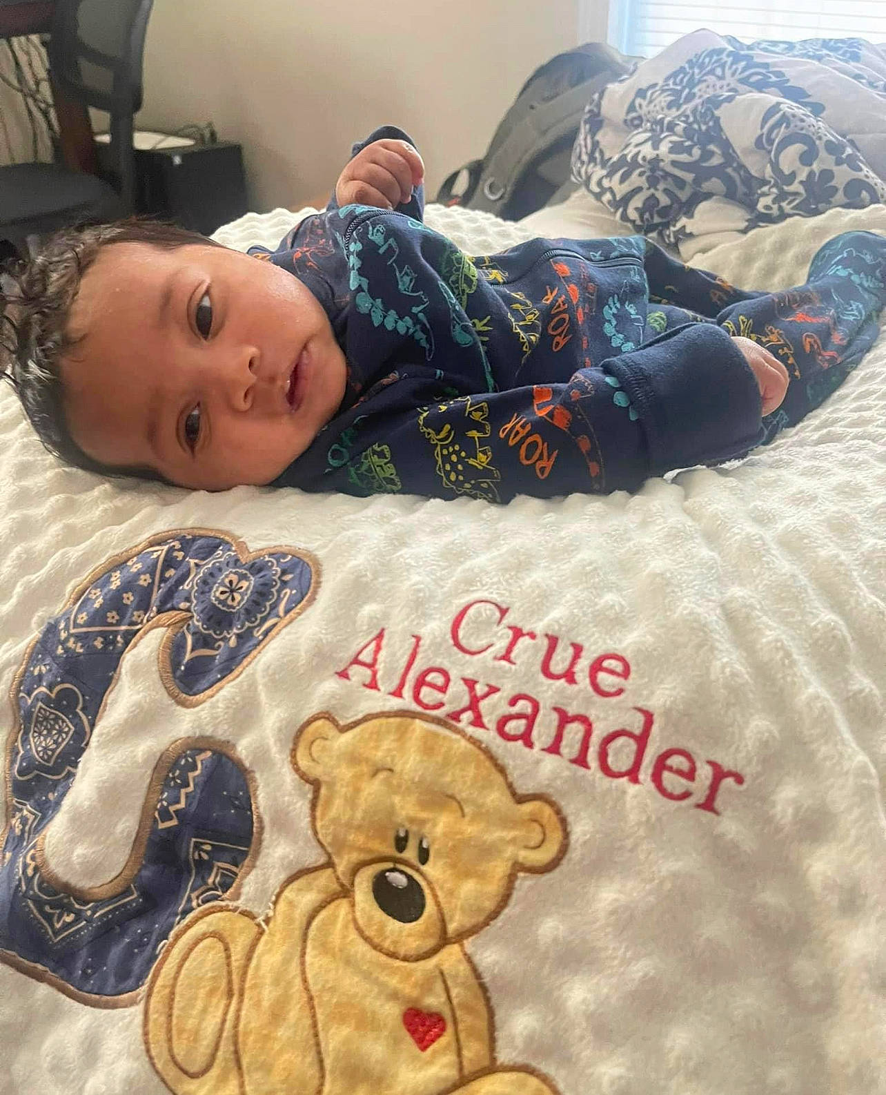 Crue is registered to the contest to win money with this photo: art, baby_sleeping, baby_toddler_clothing, bed_sheet, bedding, bedtime, child, comfort, cool, flooring, font, happy, linens, pattern, person, product, sleeve, t_shirt, textile, toddler