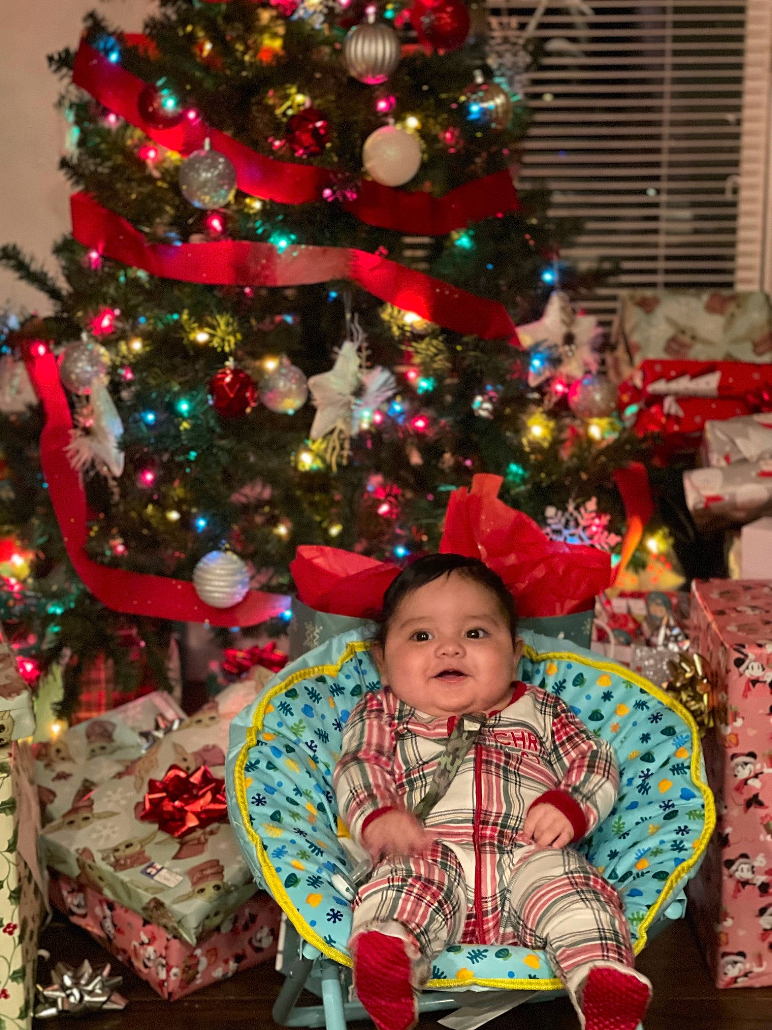 Evan is registered to the contest to win money with this photo: baby_toddler_clothing, christmas, christmas_decoration, christmas_eve, christmas_ornament, christmas_tree, conifer, event, evergreen, fun, green, holiday, holiday_ornament, interior_design, ornament, person, room, toddler, tradition, tree