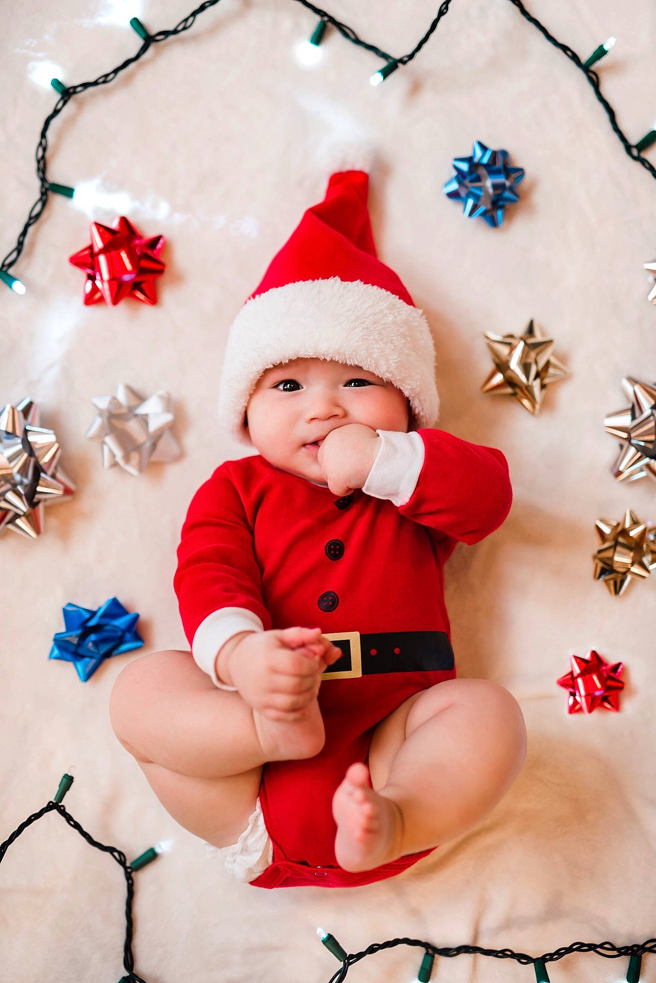 Anderson is registered to the contest to win money with this photo: child, christmas, christmas_decoration, christmas_ornament, facial_expression, fictional_character, girl, hair_accessory, happiness, headwear, holiday, infant, person, product, red, santa_claus, skin, smile, toddler