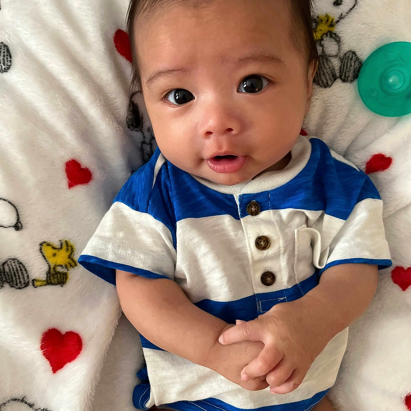 Levi joined the competition — help win amazing prizes! baby, blanket, bodypart, clothing, face, finger, hand, happy, head, newborn, people, person, photography, portrait, quilt, shorts, sitting, sleeve, smile, t_shirt