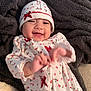 Arely joined the competition — help win amazing prizes! baby, smiling, infant, pajamas, holiday, hat, blanket, lying_down, happy, cute, child, face, hand, cozy, indoors, person, apparel, expression, newborn, soft