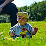 Vincent joined the competition — help win amazing prizes! toddler, child, grass, outdoor, toy, cap, sweater, teddy_bear, person, adult, bench, sunlight, nature, greenery, casual, cute, serious, daytime, playing, park