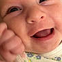 Staylee joined the competition — help win amazing prizes! baby, close_up, face, smiling, happy, infant, skin, eyes, mouth, hand, fist, clothing, floral_pattern, cute, expression, portrait, child, young, person, indoors