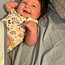 Staylee joined the competition — help win amazing prizes! baby, infant, smiling, bed, pillow, blanket, onesie, child, happy, lying_down, face, cute, sleepwear, comfort, indoor, person, young_child, portrait, resting, cozy