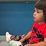 Francisco Zayden joined the competition — help win amazing prizes! toddler, child, sitting, red_shirt, patterned_pants, white_shoes, indoor, dental_clinic, waiting, bench, floor, hair, face, profile, young_child, colorful, casual_clothing, cute, patient, portrait