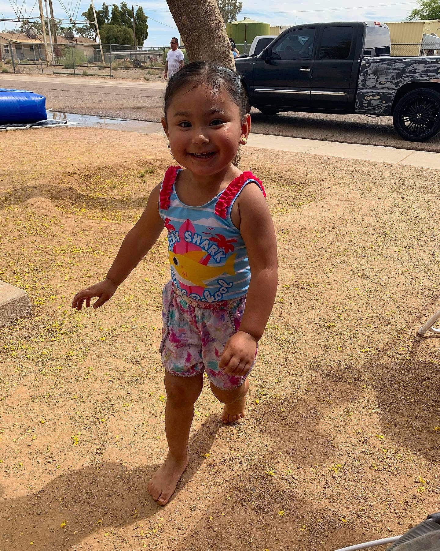 Ysabelle joined the competition — help win amazing prizes! automotive_tire, barefoot, car, child, fun, happy, human_leg, joy, people_in_nature, person, public_space, sky, smile, summer, t_shirt, thigh, tire, toddler, travel, tree