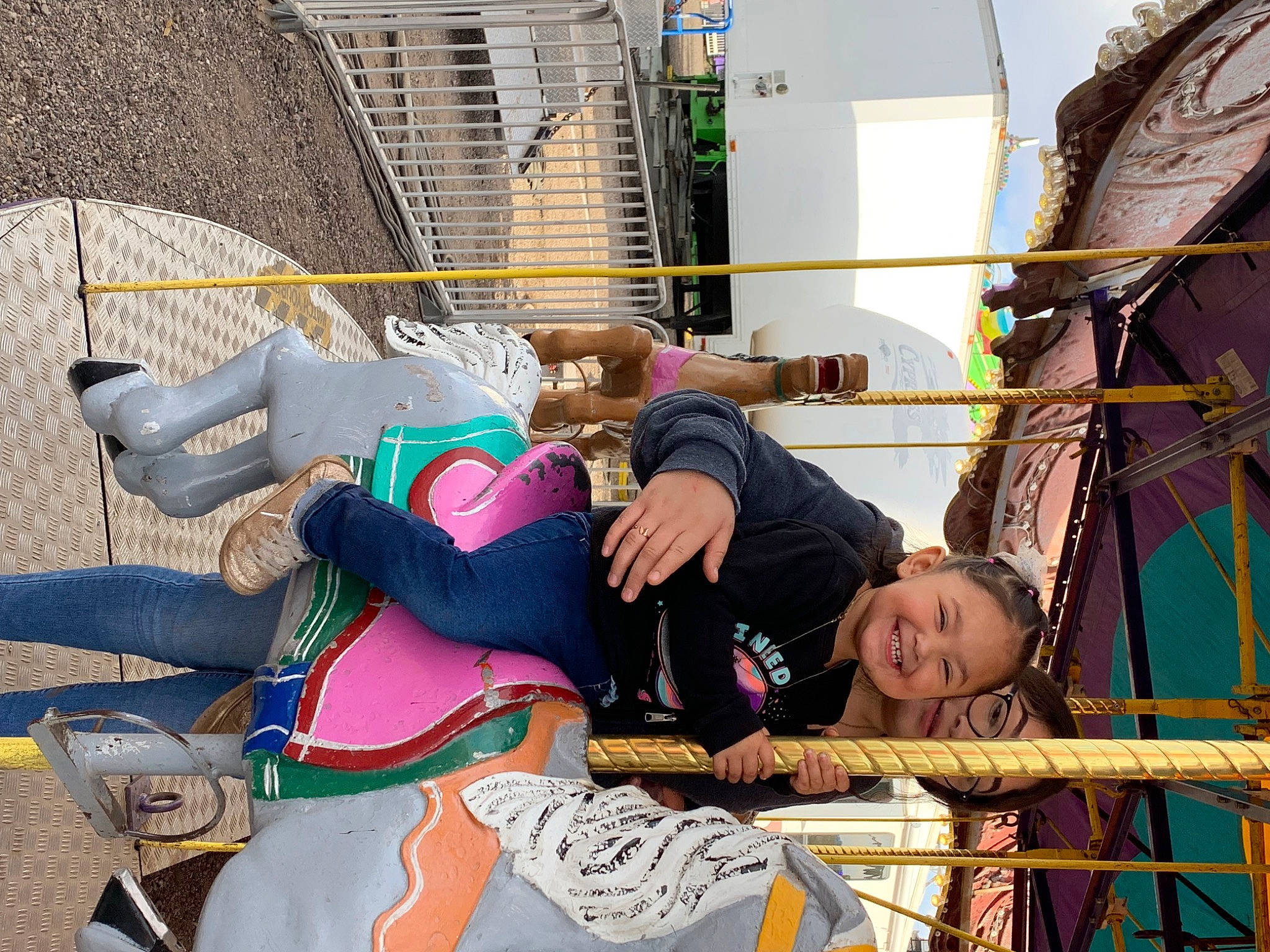 Ysabelle is registered to the contest to win money with this photo: building, child, city, event, fun, happy, hat, joy, landscape, leisure, person, public_event, recreation, rope, tourism, tradition, travel, vacation