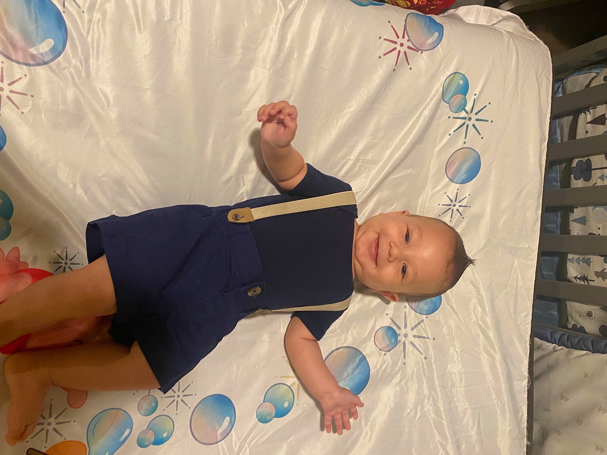 Luka joined the competition — help win amazing prizes! arm, baby, baby_toddler_clothing, bed, bedding, blue, child, comfort, elbow, fun, joy, knee, leisure, linens, pattern, person, room, shorts, t_shirt, textile