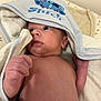 baby, infant, newborn, towel, hood, stitch, blue, skin, face, hand, blanket, soft, cute, lying_down, indoors, expression, curious, young_child, portrait, resting