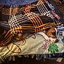 dog, blanket, couch, pet, indoor, resting, brown, white, face, fur, comfort, cozy, fabric, pattern, home, furniture, relaxation, animal, paw, floor