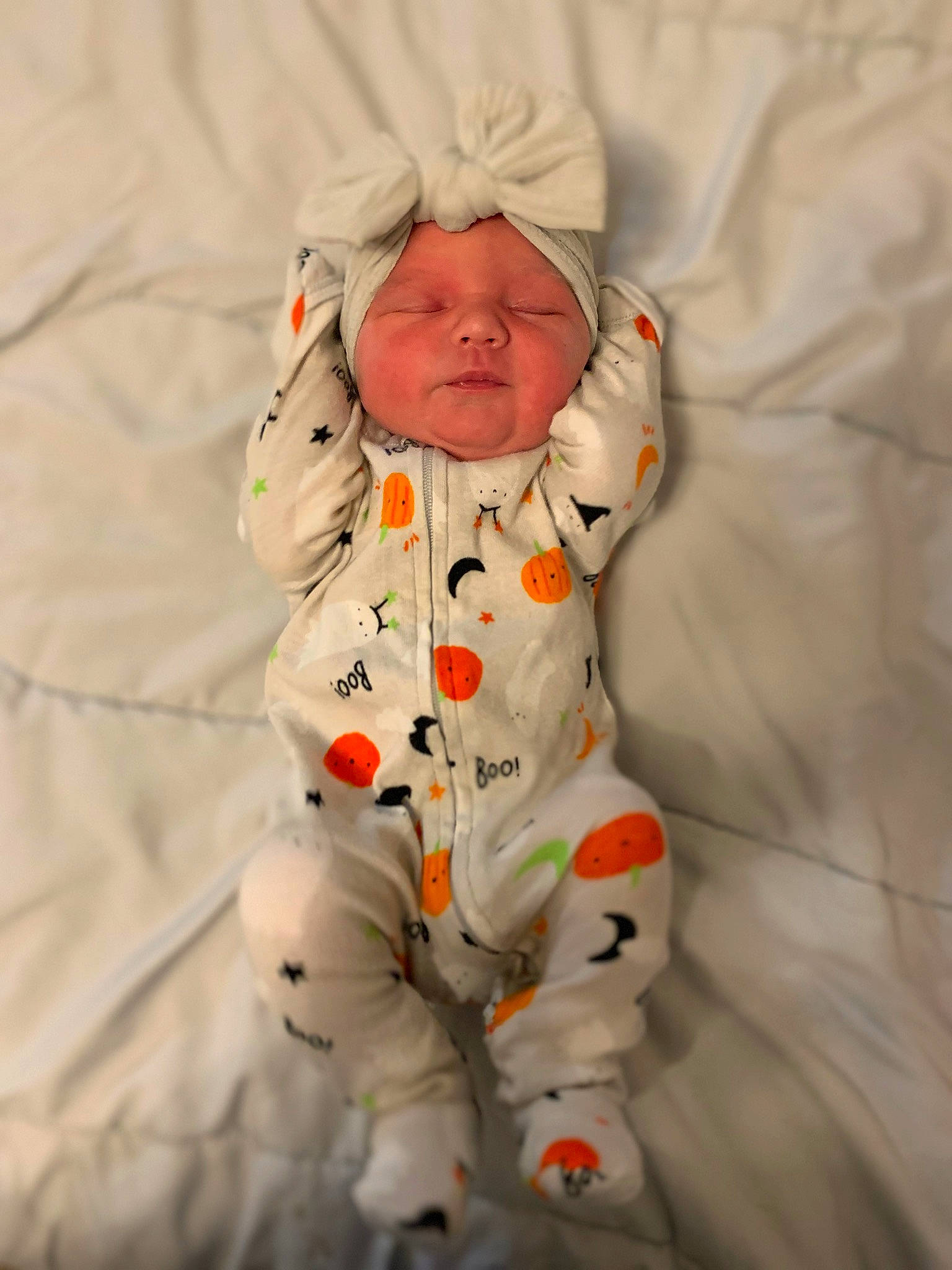 Delilah is registered to the contest to win money with this photo: baby, baby_products, baby_sleeping, baby_toddler_clothing, child, comfort, fun, hand, happy, head, headwear, linens, outerwear, pattern, peach, person, portrait_photography, sitting, sleeve, textile