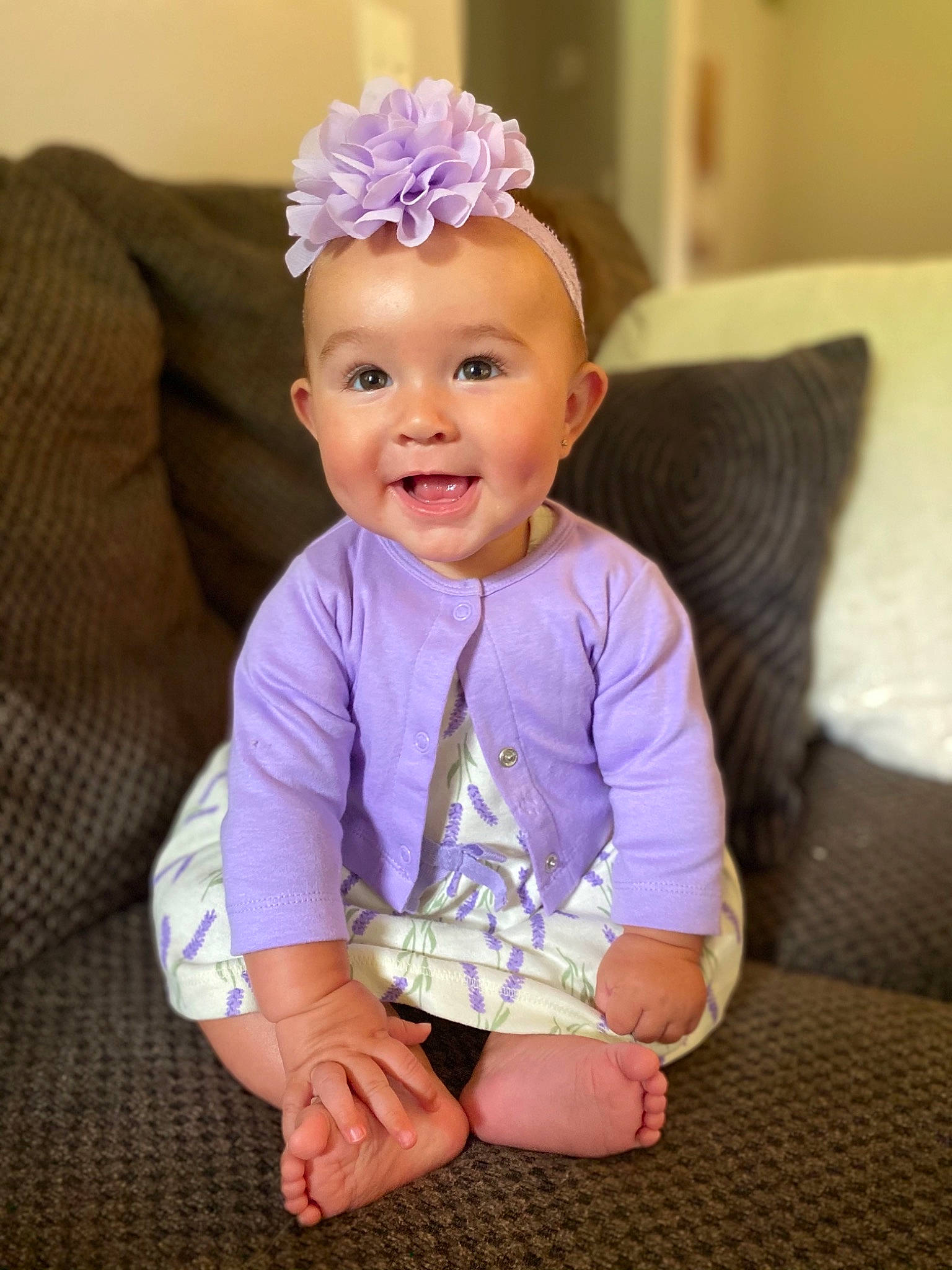 Gracee joined the competition — help win amazing prizes! baby, baby_toddler_clothing, child, comfort, couch, eye, foot, hair_accessory, hand, headpiece, home_accessories, lavender, living_room, mouth, nose, person, pillow, purple, smile, throw_pillow