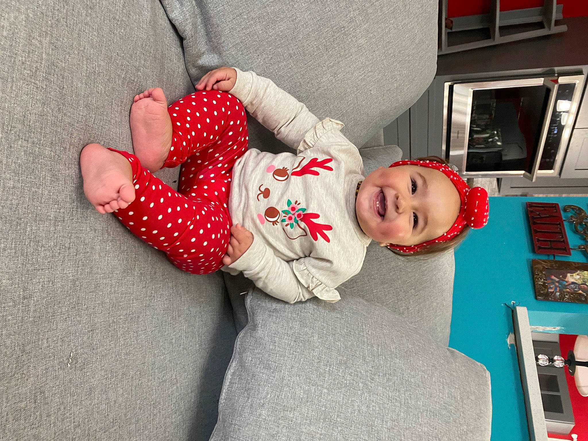 Gracee is registered to the contest to win money with this photo: baby, baby_toddler_clothing, carmine, child, comfort, headwear, home, joy, person, polka_dot, sock, toddler