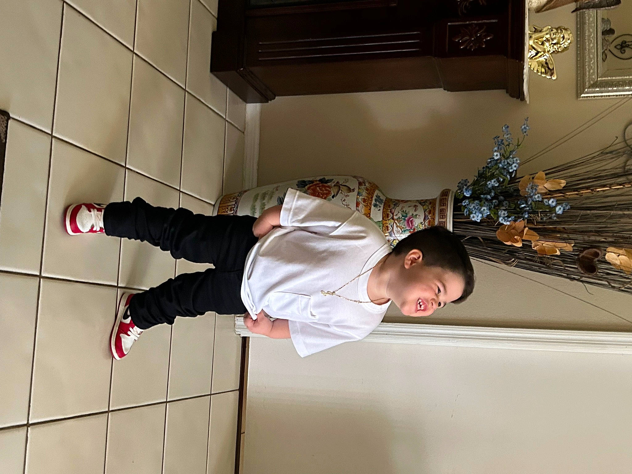 Jeremiah is registered to the contest to win money with this photo: ceiling, flooring, fun, human_leg, person, room, walking_shoe