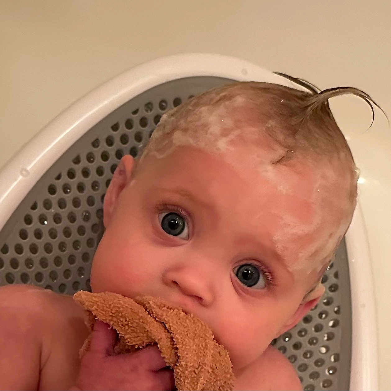 Lainey is registered to the contest to win money with this photo: baby, child, bath, bathtub, foam, shampoo, hair, washcloth, cute, blue_eyes, skin, toddler, infant, water, bathroom, seat, expression, wet, person, head