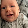 Jackson joined the competition — help win amazing prizes! baby, smiling, face, eyes, clothing, ribbed_fabric, zipper, infant, cozy, blanket, bed, happy, cute, closeup, skin, person, young_child, indoors, soft_texture, portrait