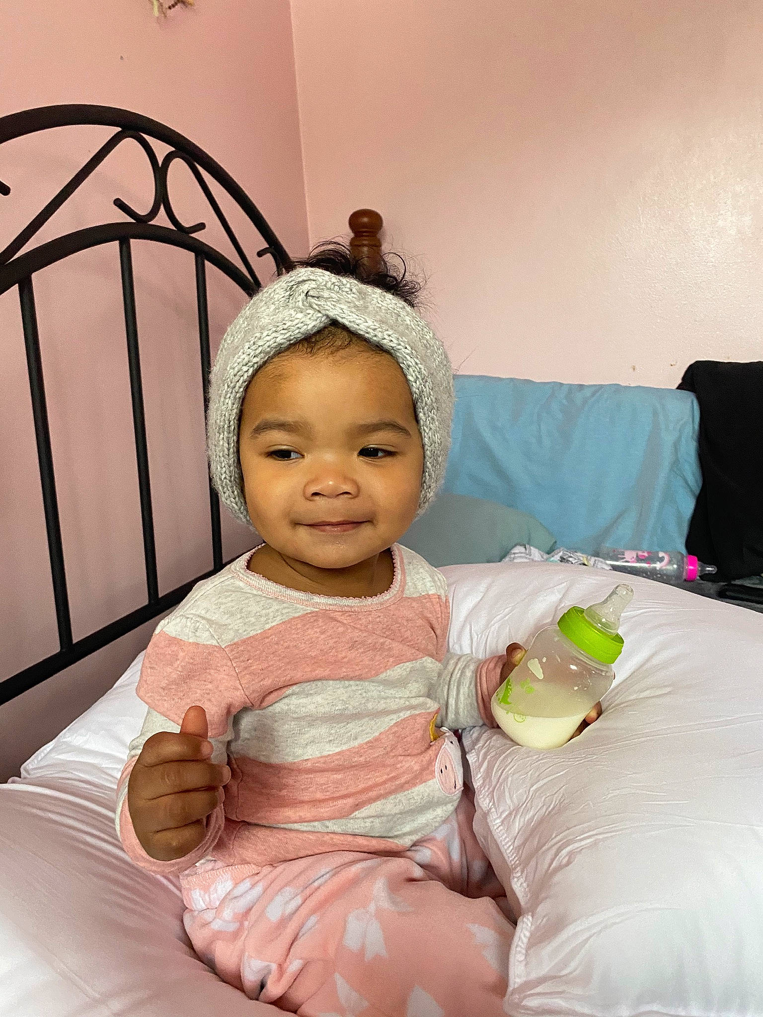 Iyla joined the competition — help win amazing prizes! baby, baby_toddler_clothing, child, comfort, dress, event, eyelash, fun, happy, headband, headpiece, joy, linens, peach, person, pink, room, sitting, skin, smile