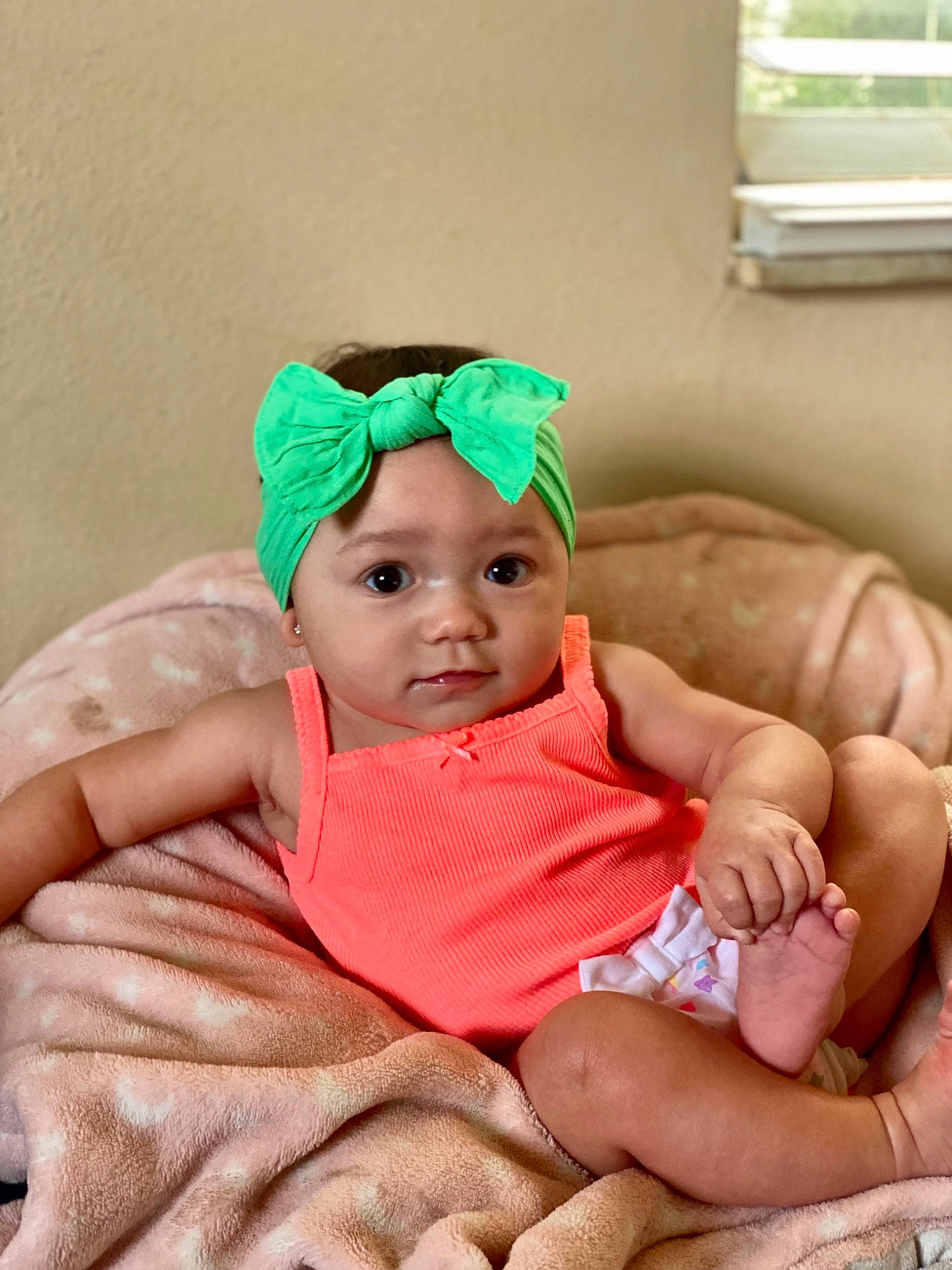 Amalia joined the competition — help win amazing prizes! baby, baby_products, baby_toddler_clothing, cap, chair, cheek, child, comfort, event, eye, fashion_accessory, happy, headwear, linens, peach, person, room, sitting, skin, thumb