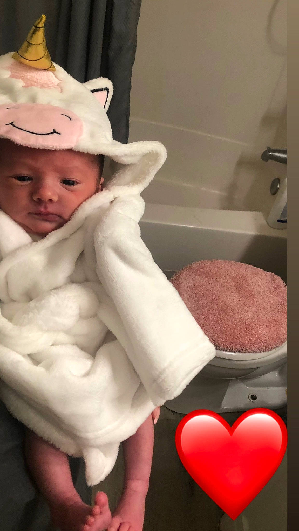 Kara is registered to the contest to win money with this photo: baby, baby_toddler_clothing, bathroom, bathtub, cap, child, comfort, fashion_accessory, fur, hat, headgear, headwear, linens, organ, person, pink, plumbing, plumbing_fixture, room, skin