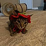 Aries is registered to the contest to win money with this photo: cat, tabby, hat, red, knitted, carpet, indoor, playful, toy, tunnel, curious, pet, animal, ears, whiskers, front_paws, floor, home, cute, cozy
