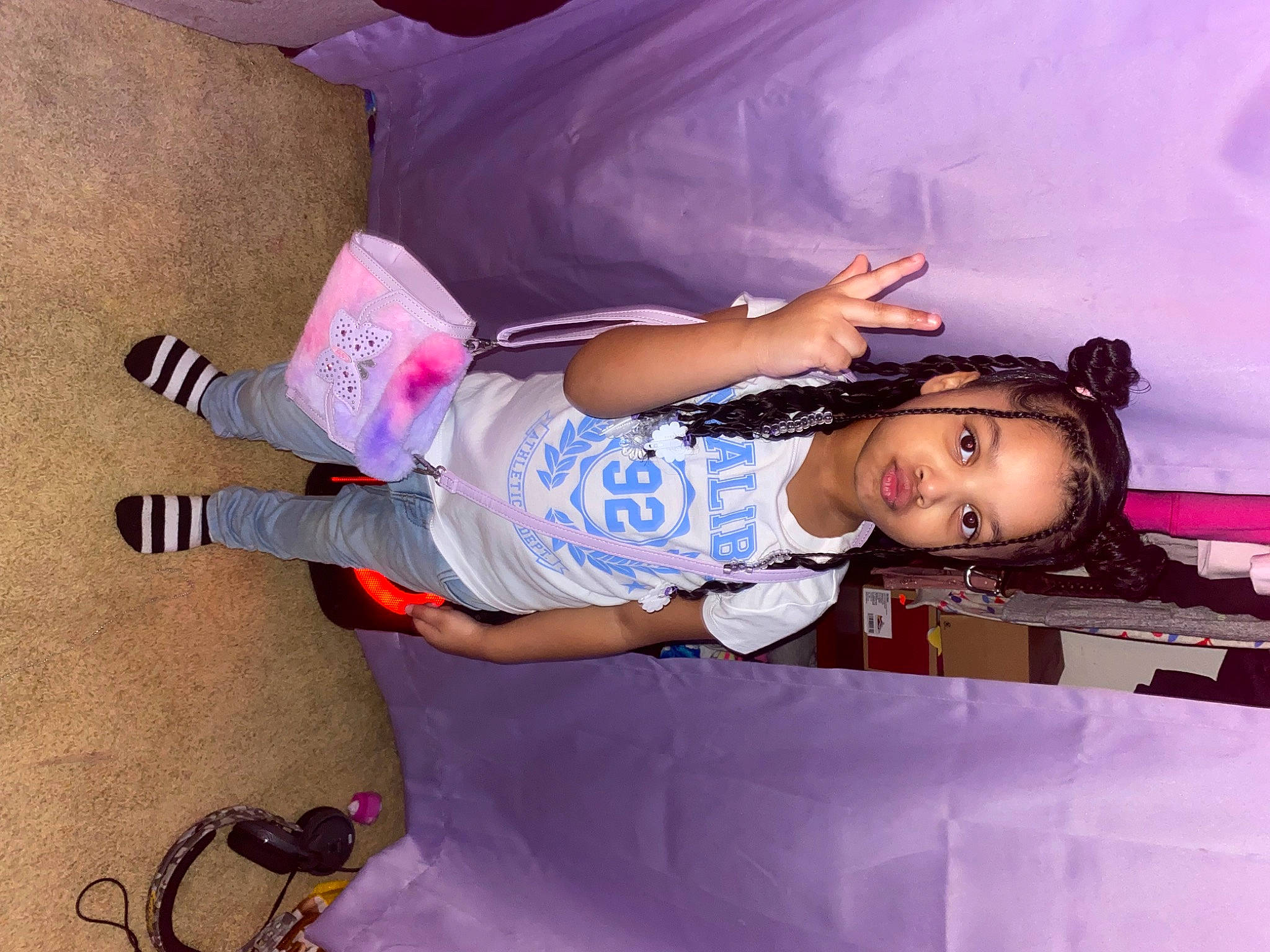 Naomi is registered to the contest to win money with this photo: baby_toddler_clothing, child, fashion_design, fun, happy, human_leg, leisure, magenta, person, pink, play, purple, sitting, thigh, toddler, toy