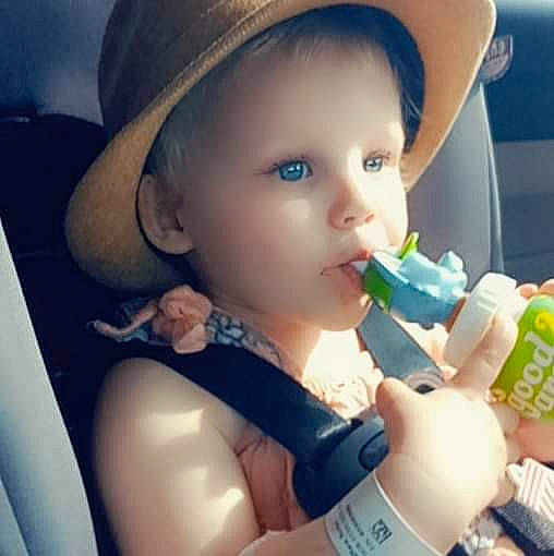Rozlyn joined the competition — help win amazing prizes! baby, baby_bottle, bottle, cap, cheek, cool, drinkware, eyebrow, eyelash, finger, hand, happy, hat, headwear, lip, mouth, nose, person, plastic_bottle, skin