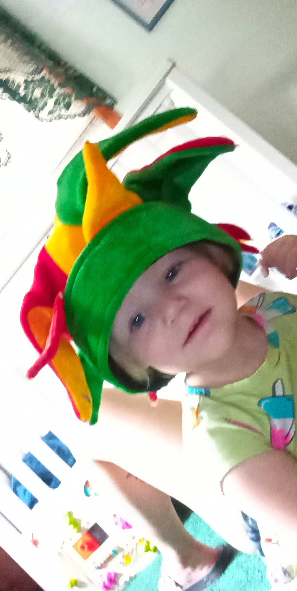 Rozlyn is registered to the contest to win money with this photo: baby, baby_products, cap, child, christmas_eve, costume, costume_hat, event, fictional_character, fun, fur, green, happy, hat, headwear, holiday, person, personal_protective_equipment, recreation, smile