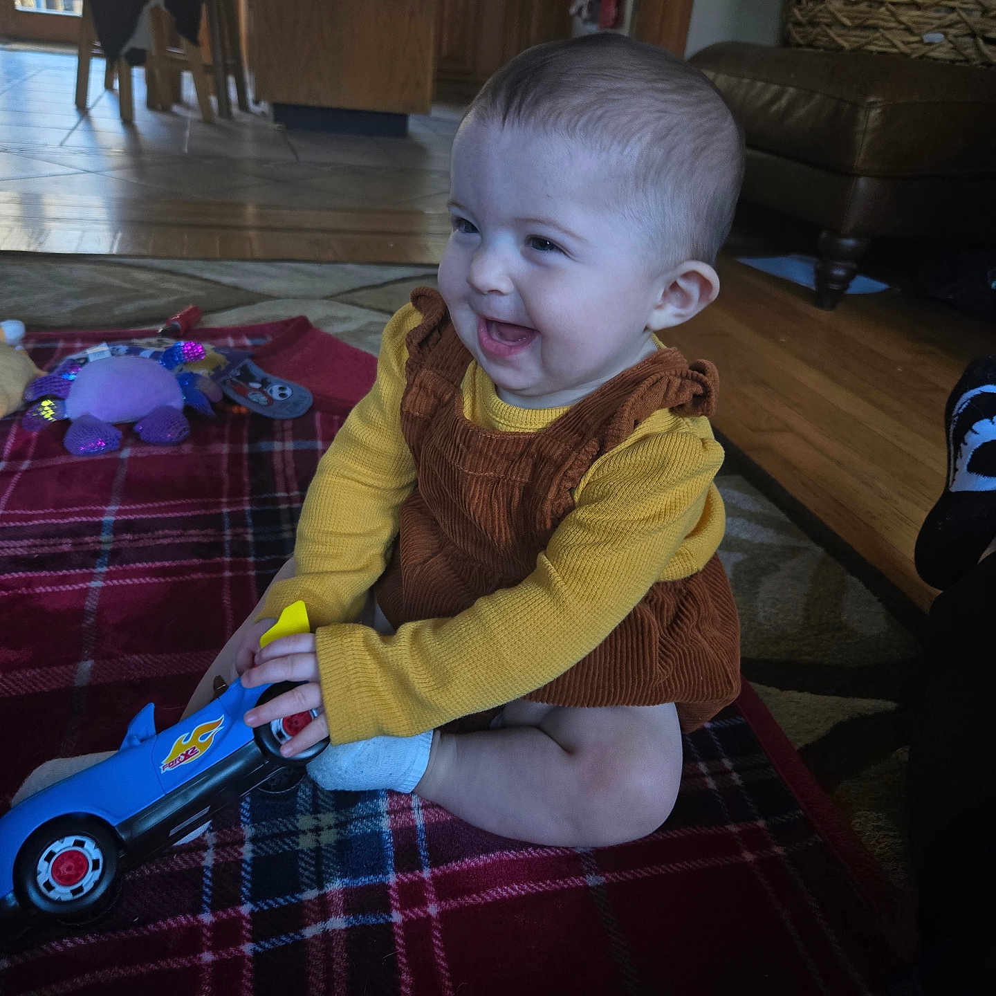Evelyn joined the competition — help win amazing prizes! architecture, baby, building, car, clothing, couch, face, furniture, head, indoors, livingroom, pants, person, photography, portrait, room, toy, transportation, vehicle, wood
