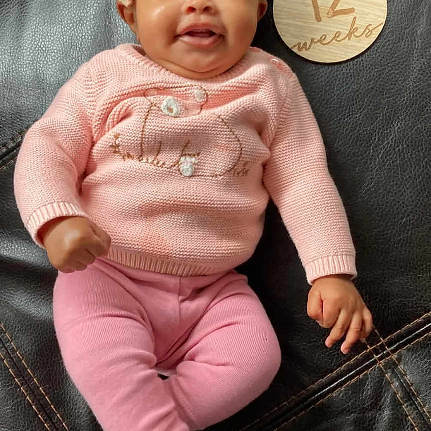 Naijarae Welch is registered to the contest to win money with this photo: baby, bodypart, clothing, cushion, face, furniture, glove, happy, hat, head, homedecor, hosiery, newborn, pants, person, photography, portrait, sitting, smile, sock