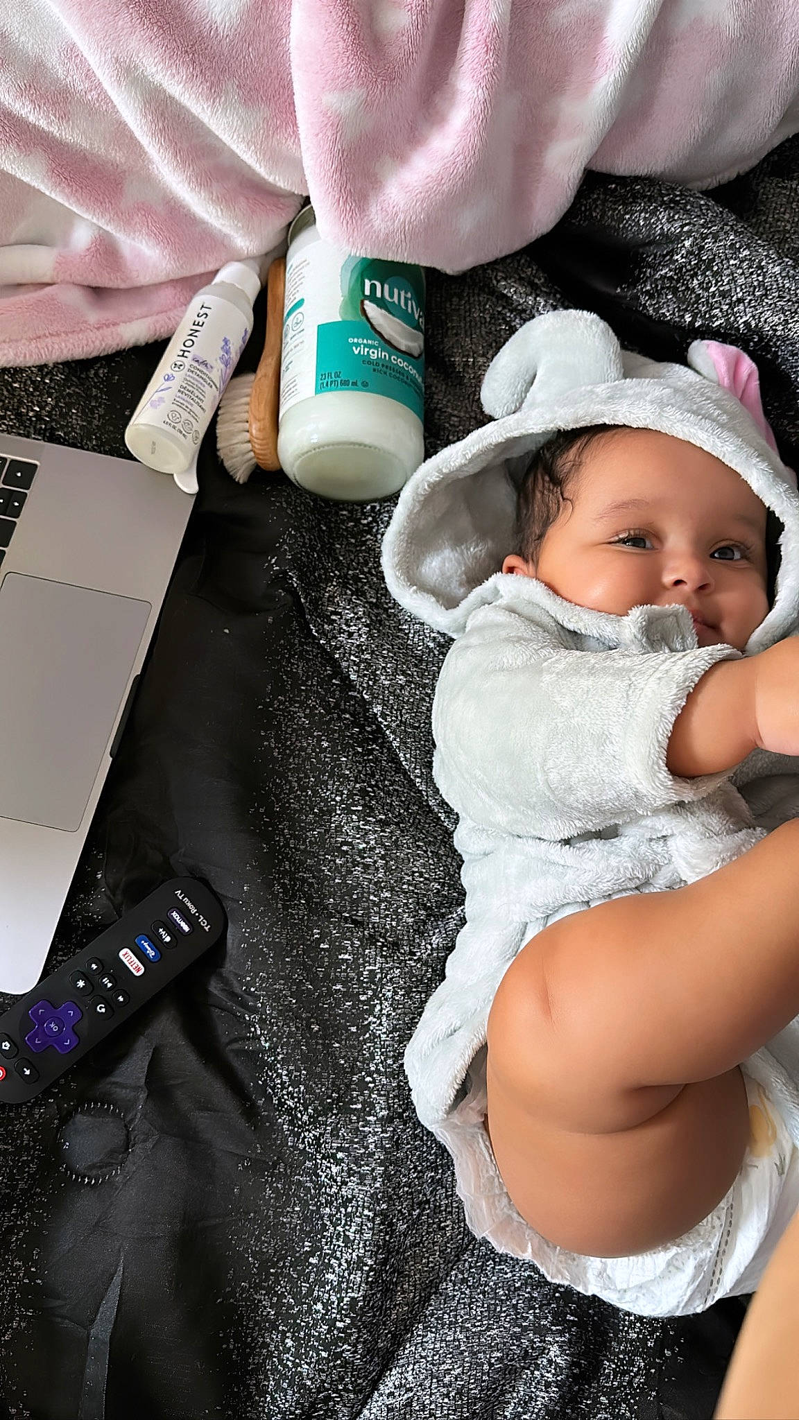 Zuri is registered to the contest to win money with this photo: baby, baby_products, baby_toddler_clothing, cap, child, comfort, costume_hat, fashion_accessory, fedora, flash_photography, happy, hat, headband, headwear, linens, pattern, person, sitting, sun_hat, textile