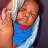 Nykie joined the competition — help win amazing prizes! baby, sleeping, infant, blue_clothing, blanket, hand, closeup, peaceful, resting, child, portrait, indoor, soft_texture, curly_hair, cozy, wrapped, cute, young_child, skin, toddler