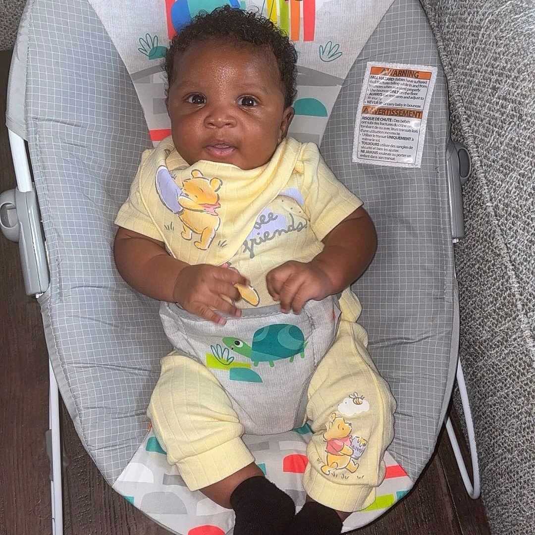Nykie joined the competition — help win amazing prizes! baby, baby_rocker, cartoon, child, colorful, comfortable, cute, flooring, gray_furniture, happy, indoor, infant, person, plush_toys, portrait, sitting, smiling, winnie_the_pooh, wood_floor, yellow_clothing